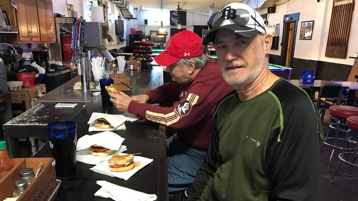 Niles Williams, front, and Steve Olsen are long-time Council’s regulars who hope the Bradenton landmark remains open and true to its tradition.
