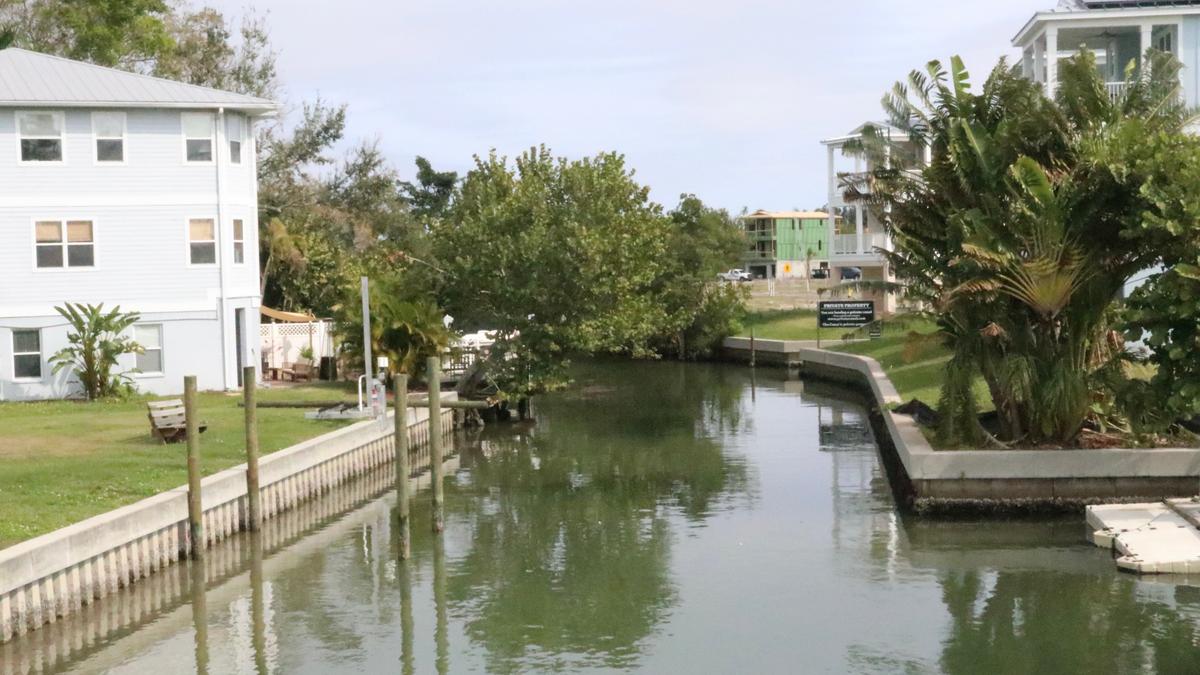 The developer of Hunters Point recently placed pilings displaying navigational aids in a Cortez canal. The Southwest Florida Water Management District is investigating whether this was legal and if the developer should face penalties. The canal feeds into Sarasota Bay.