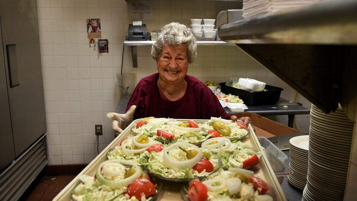 Bradenton’s icon of family dining and pizza, Demetrios, will be closing their doors on April 16. They are so grateful to the community who has loved them all the years they have been open, they say, but they want to have time for their family. Helen Sokos holds a tray of the famous greek salad.