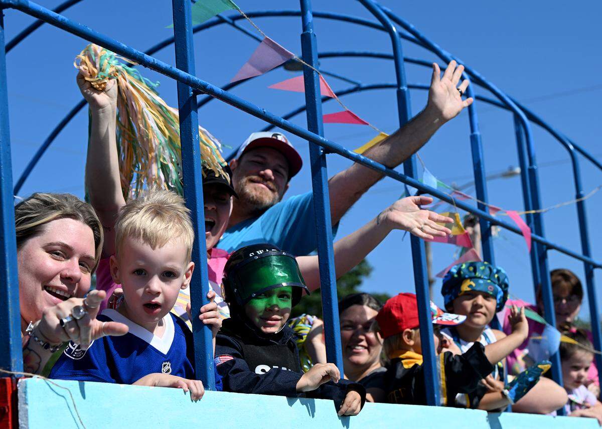 Families wave from a Dr. Seuss float at the annual DeSoto Children’s Parade and Party in the Park in Palmetto on April 18, 2025.
