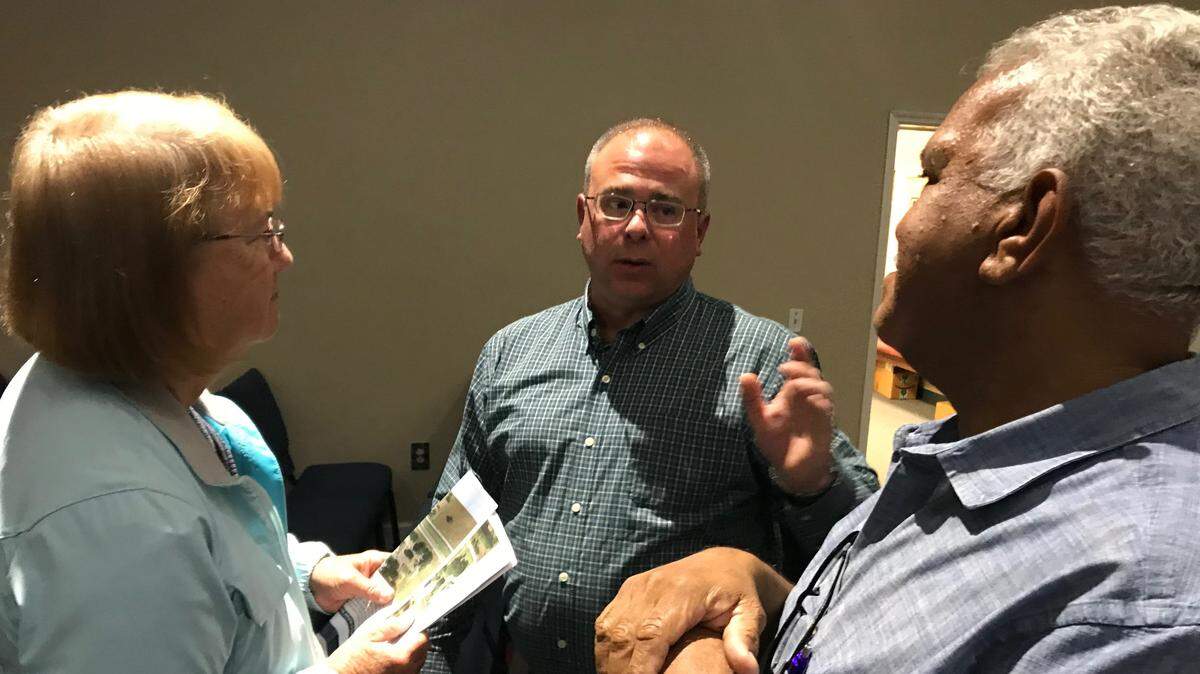 Traffic engineer Keith Slater (center) found himself on the hot seat Thursday night as he explained the Florida Department of Transportation’s plans to the community for improving safety at the intersection of U.S. 301 and C.R. 675 in Parrish.