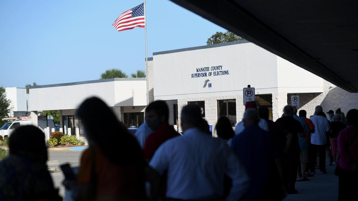 Voters line up outside the Supervisor of Elections office in Bradenton for early voting.