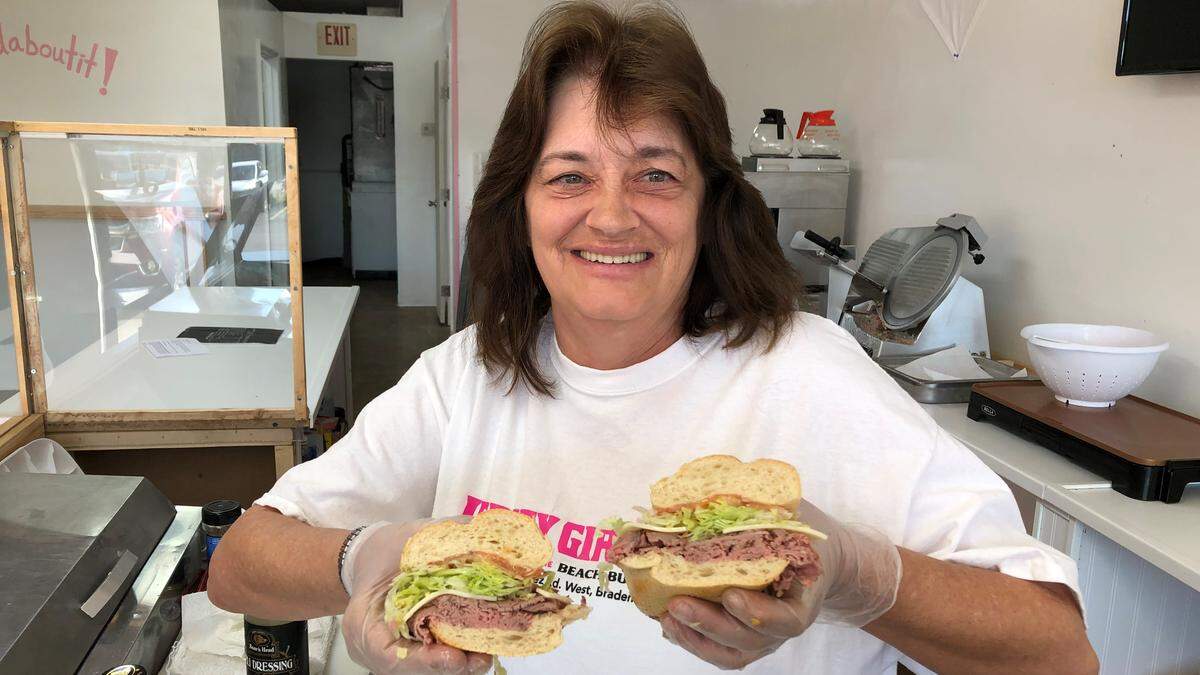 Renee Heatley displays a roastbeef-and-cheese sub at Jersey Girl Subs, which opened recently at 7832 Cortez Road W. in the Coral Way Plaza.