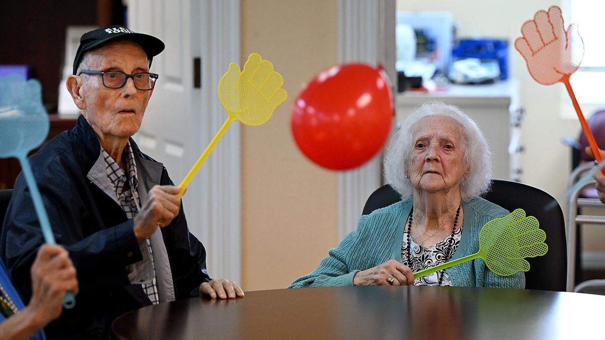 Seniors at the Daybreak Adult Day Center 10920 SR 70 E, Bradenton enjoy games of hot potato and table balloon tennis on June 26, 2024.