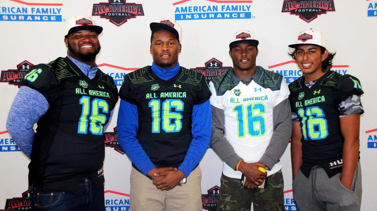 From left, IMG Academy's Shavar Manuel, Rahshaun Smith, Saivion Smith and Ricky Aguayo pose with their Under Armour All-America Game jerseys Thursday at IMG's Fieldhouse. PHOTO PROVIDED