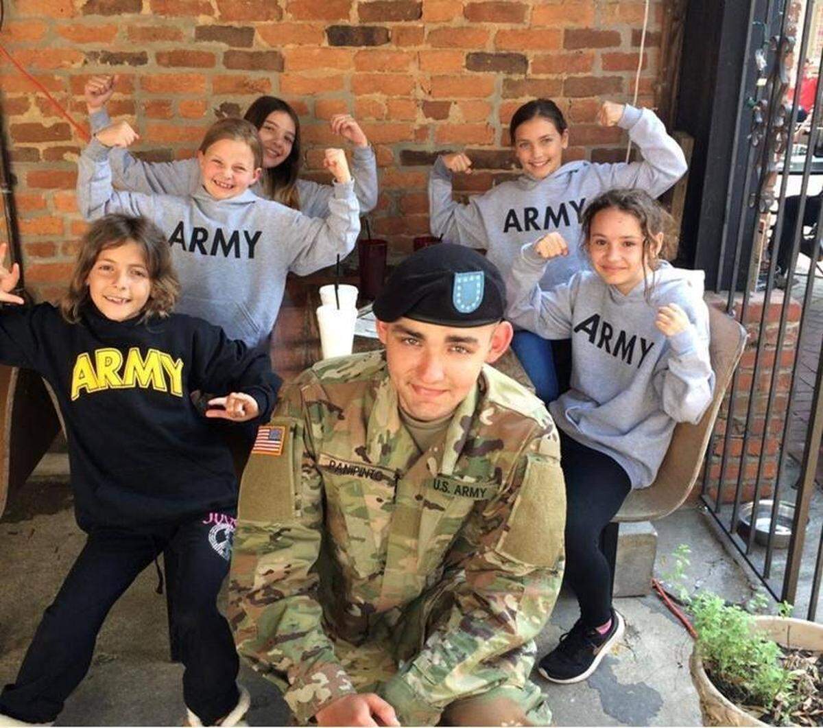 Spc. Nicholas Panipinto, pictured with his sisters and cousins, before he was killed in a training accident in South Korea last year.
