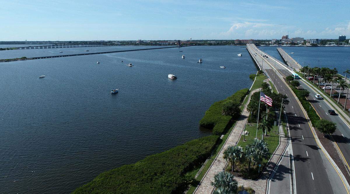 Several moored boats are regularly sitting in the waters to the east of Green Bridge when entering Palmetto. Some appear derelict; one was recently removed.