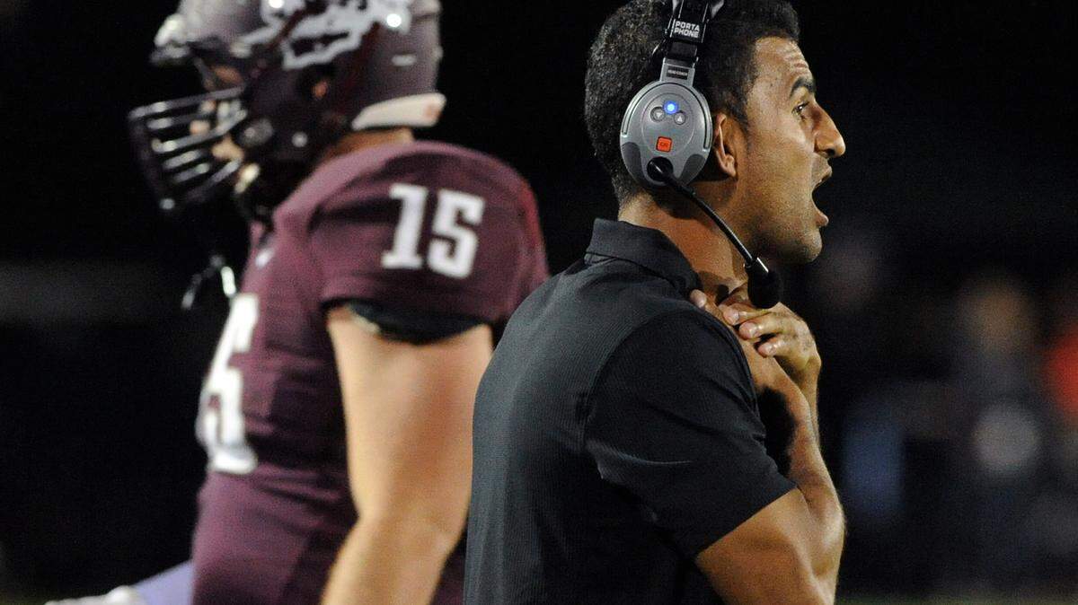 Braden River's coach Curt Bradley signals to players from the sidelines in the class 7A state semifinals game against St. Thomas Aquinas last December.
FILE PHOTO/ TIFFANY TOMPKINS-CONDIE/Bradenton Herald
