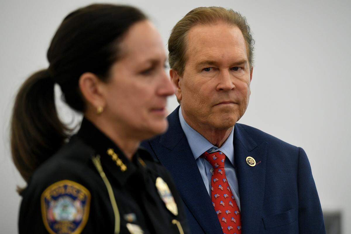 Congressman Vern Buchanan listens to Bradenton Police Chief Melanie Bevan after a law enforcement roundtable to discuss crime hosted by Buchanan.