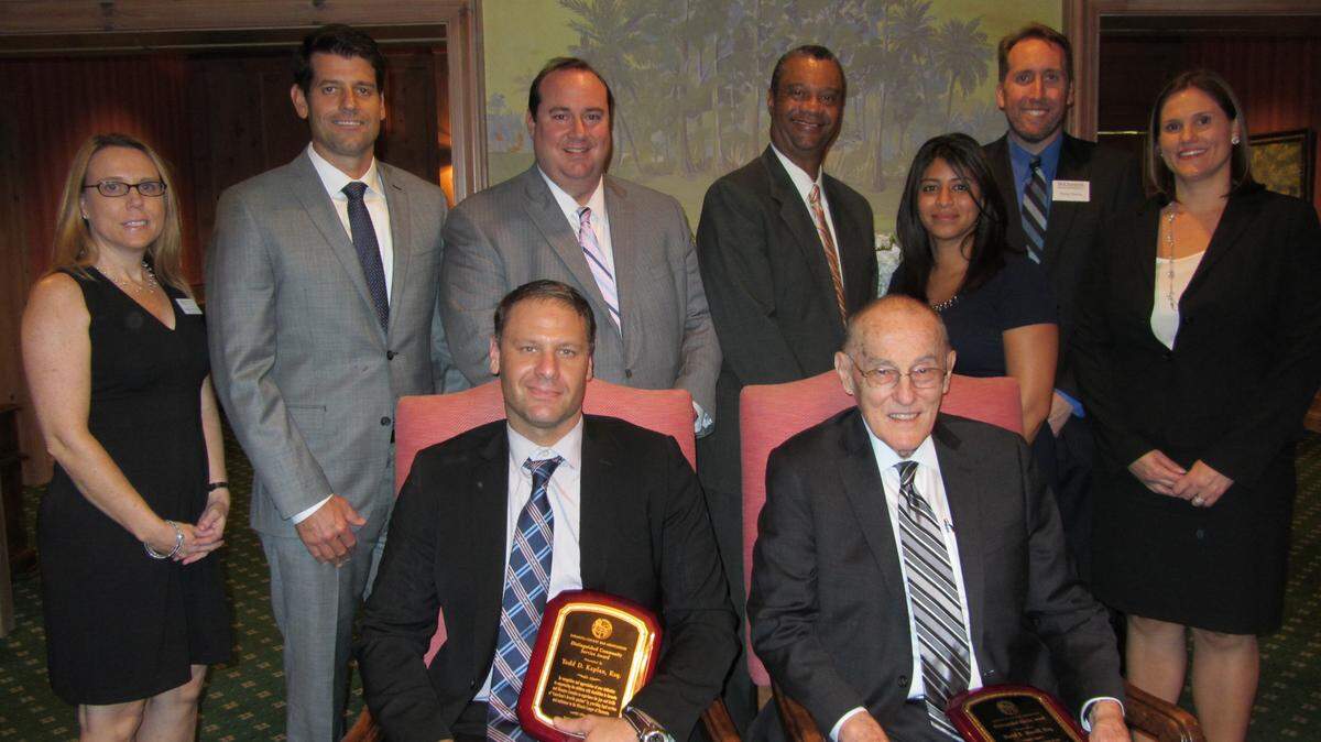 From left, seated: Todd Kaplan, Esq. and Emeritus Attorney David Morrill. From left, standing: Linda Harradine, Executive Director, Legal Aid of Sarasota; Stefan Bunecky, Chair, Awards Committee; Hunter Carroll, President, Sarasota County Bar Associtation; Chief Judge Charles Williams; Christina Unkel, Awards Committee Member; Doug Cherry; Immediate Past President, SCBA; Cyndi Riddell, Awards Committee Member (not pictured Magistrate Deborah Bailey). 
 PHOTO PROVIDED