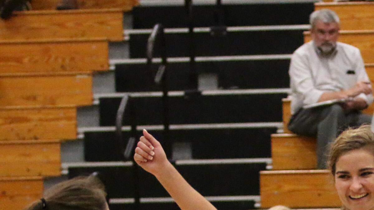 The Manatee volleyball team celebrates a kill during Tuesday night's 8A regional semifinal match between the Hurricanes and Gulf Coast.