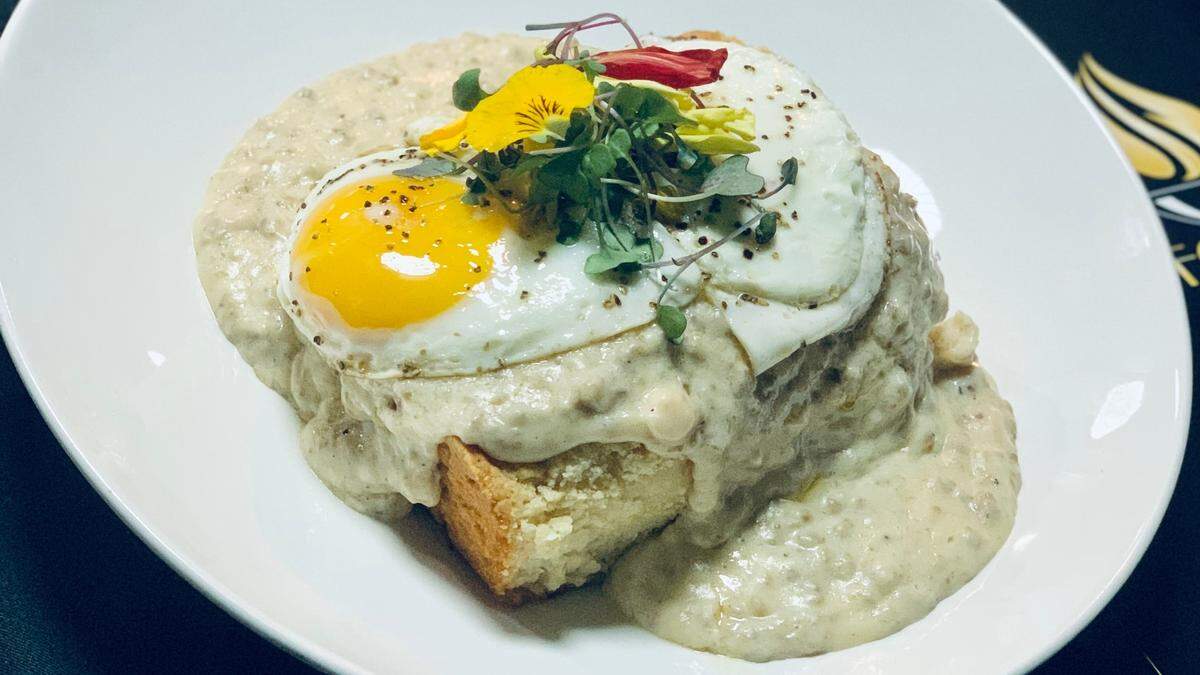 Biscuits and gravy, shown above with an egg on top, is one of the popular brunch offerings at The Food Mine, 1160 Whitfield Ave., in southern Manatee County.
