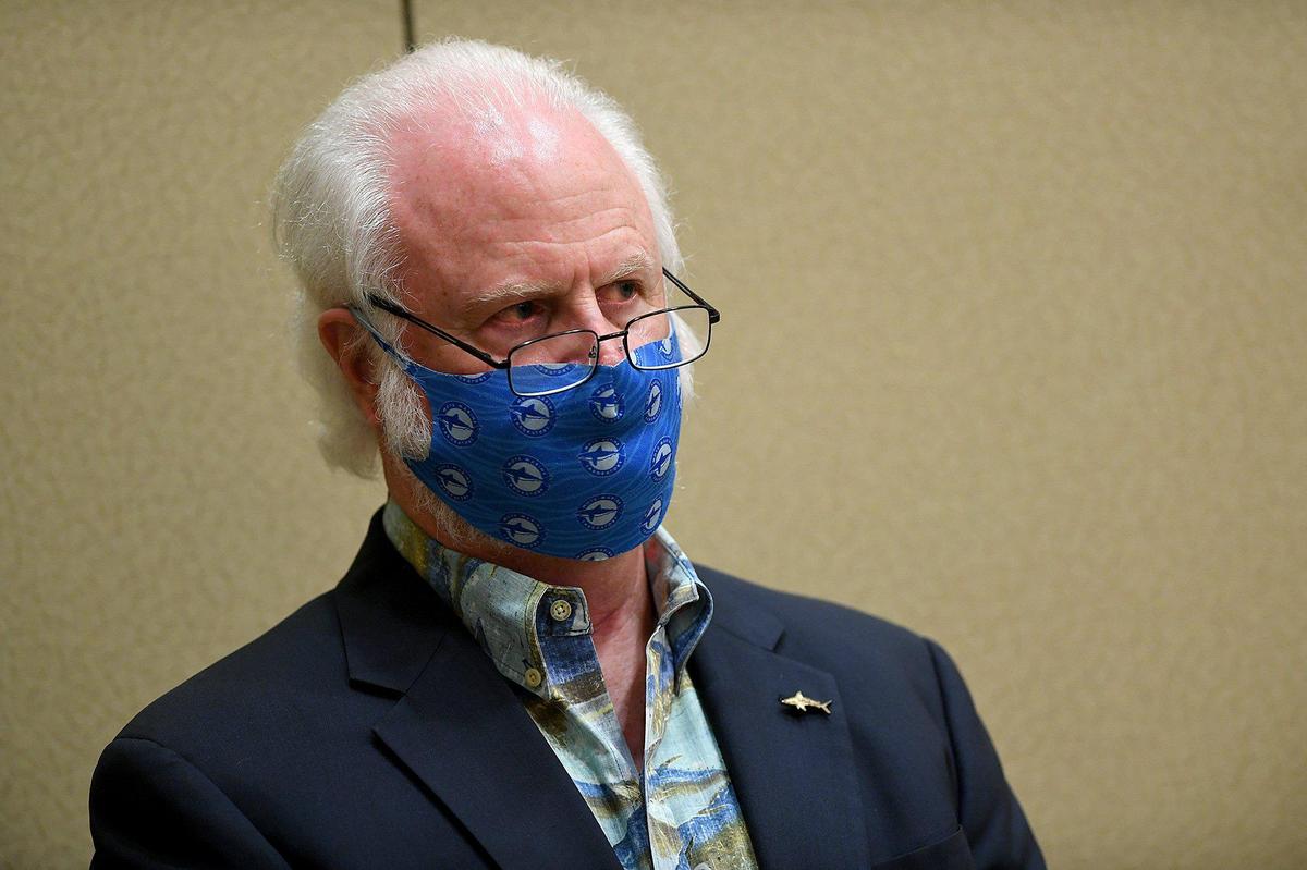 Dr. Michael Crosby, president and CEO of Mote Marine, listens to discussion before the Manatee County Commission approved an allocation of $1 million a year for five years to Mote Marine for the naming rights for a new manatee exhibit at their new facility at Nathan Benderson Park.