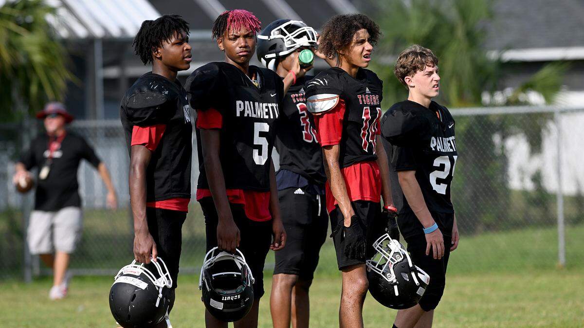 The Palmetto High football team practice at the Palmetto Charter School in the morning to try to beat the heat of the afternoons.