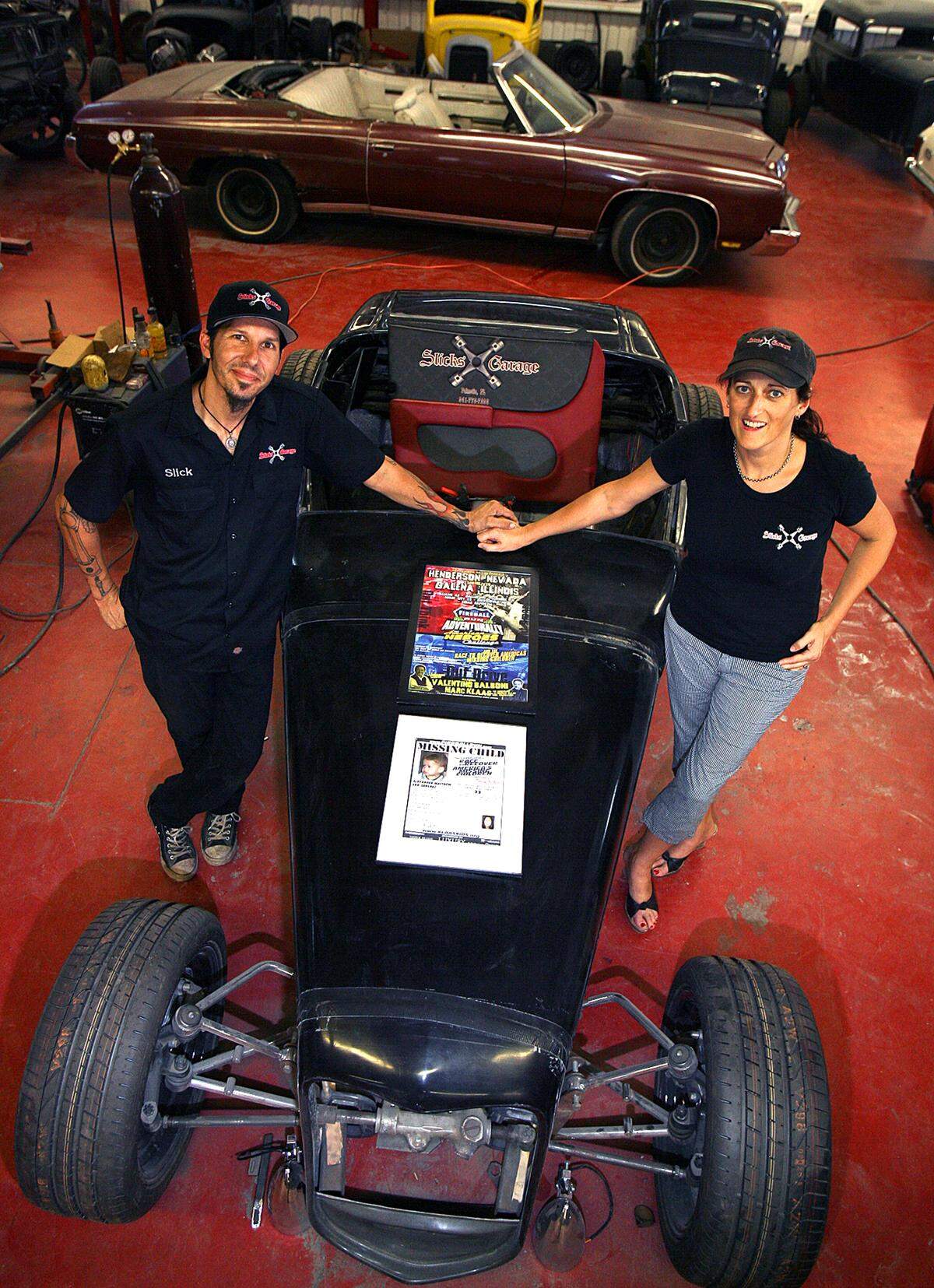 Slick and Jane Hunter of Slick’s Garage in Palmetto stand with the 32 Ultra, custom designed by Dave Koorey in this file photo.