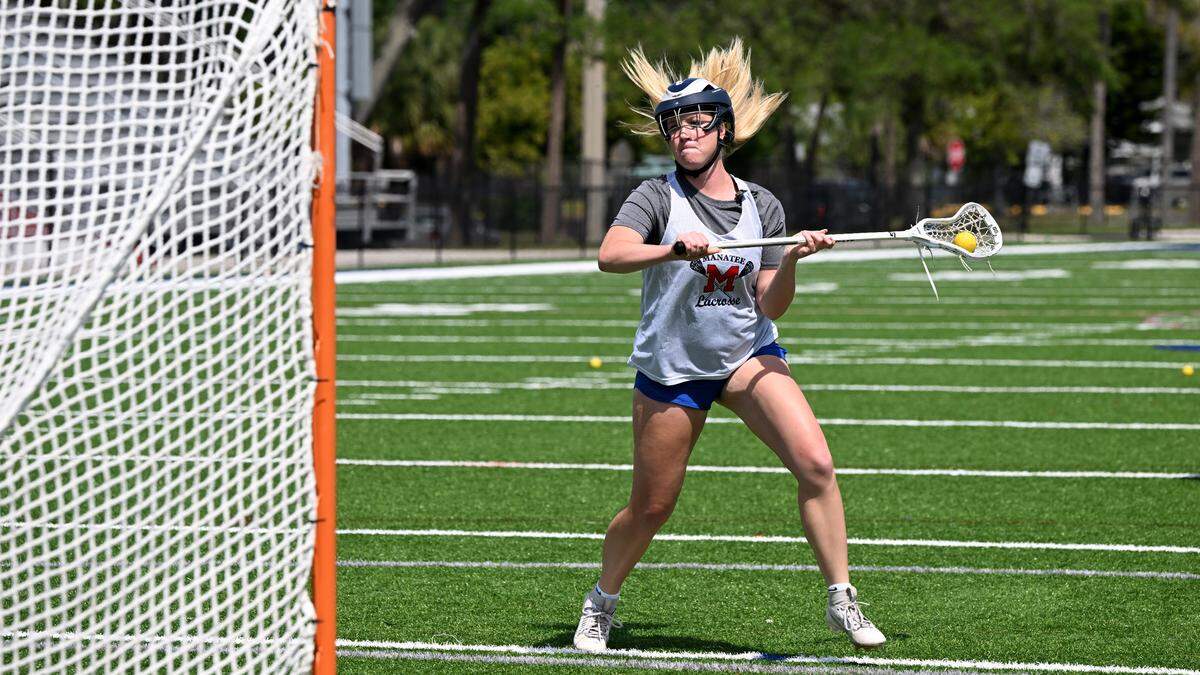 Mallory Adams works on her skills during girls lacrosse practice at Manatee High’s football stadium on Thursday, April 4, 2024.