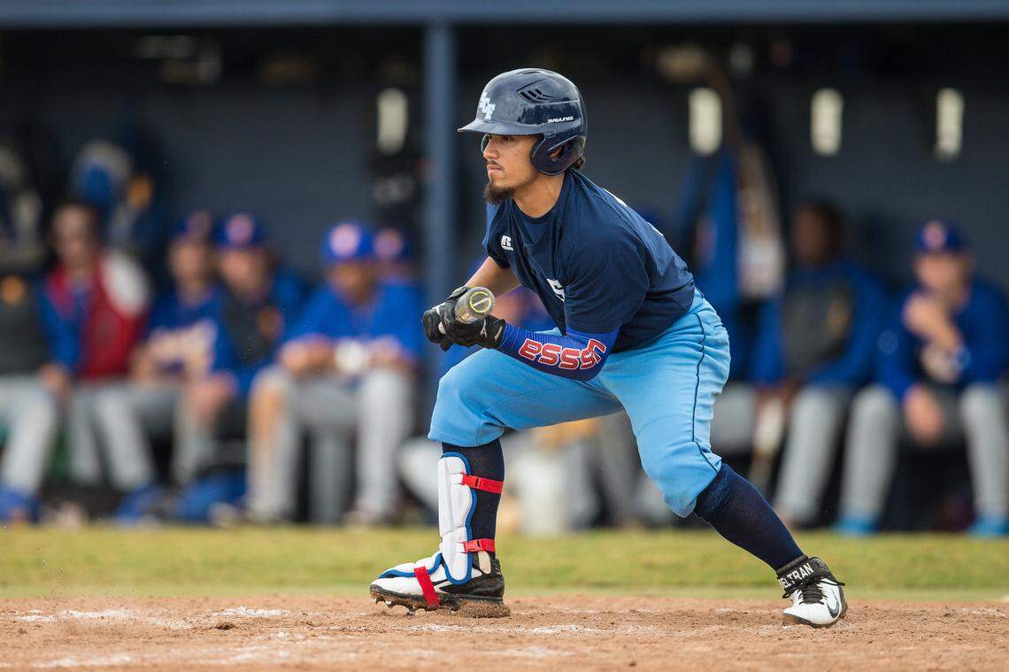 Rougie Odor squares around the bunt during a game this year. The sophomore is cousins with Texas Rangers player Rougned Odor.