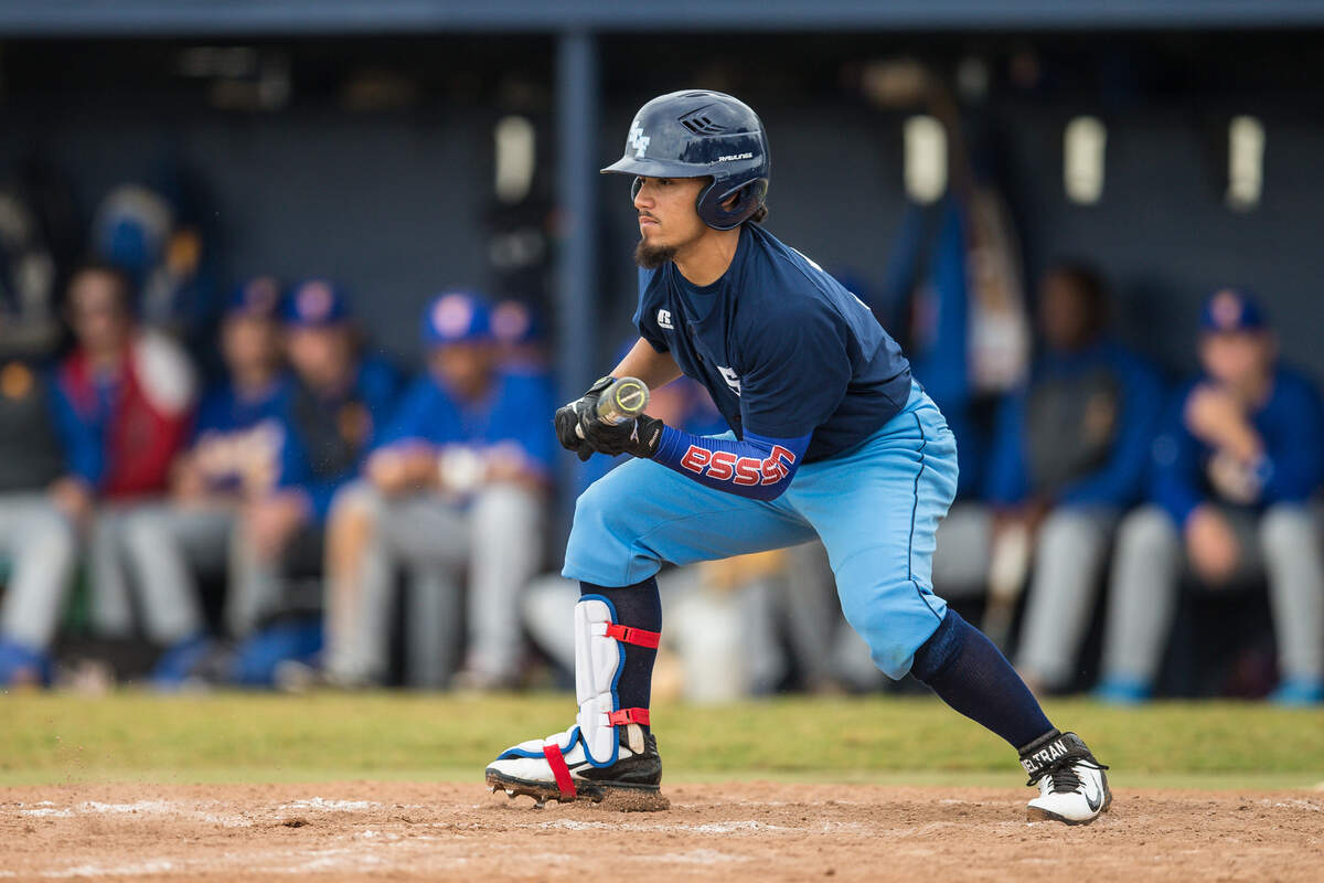 Rougie Odor squares around the bunt during a game this year. The sophomore is cousins with Texas Rangers player Rougned Odor.