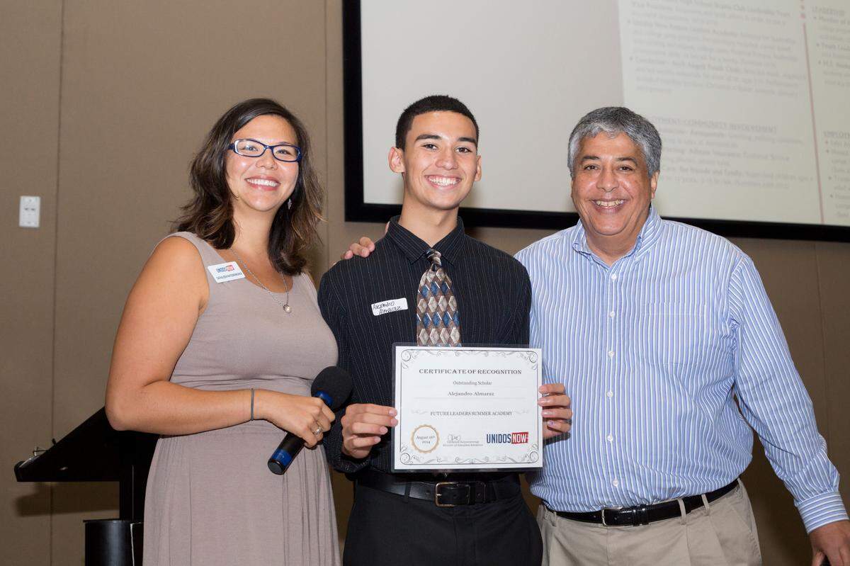 UnidosNow has helped 3,000 local students get accepted into selective schools and earn over $14 million dollars in scholarships and grants. Hector Tejeda, right, stands with one of the students he mentored.