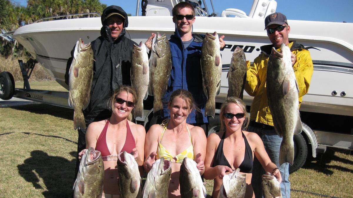 Jon Chapman, top right, on a fishing trip with friends back in December 2010.