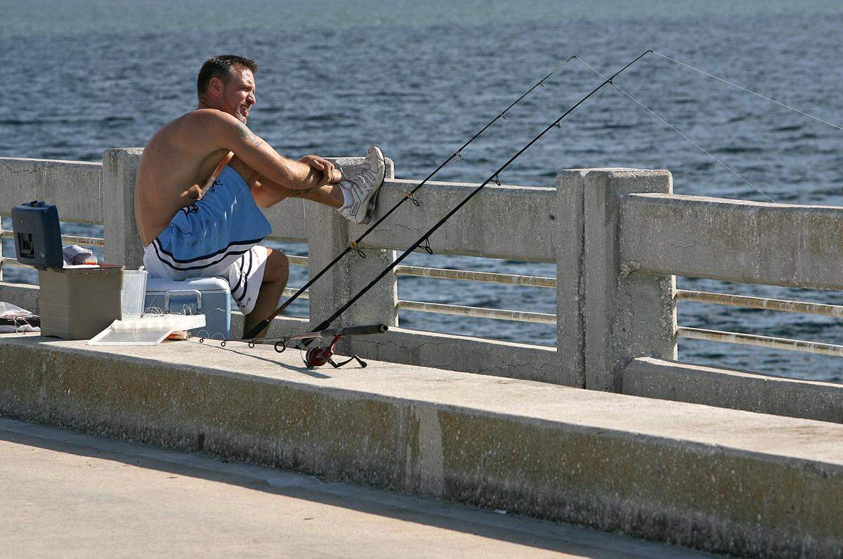 A man fishes from the south Skyway Fishing Pier in this November 2015 Bradenton Herald file photo.