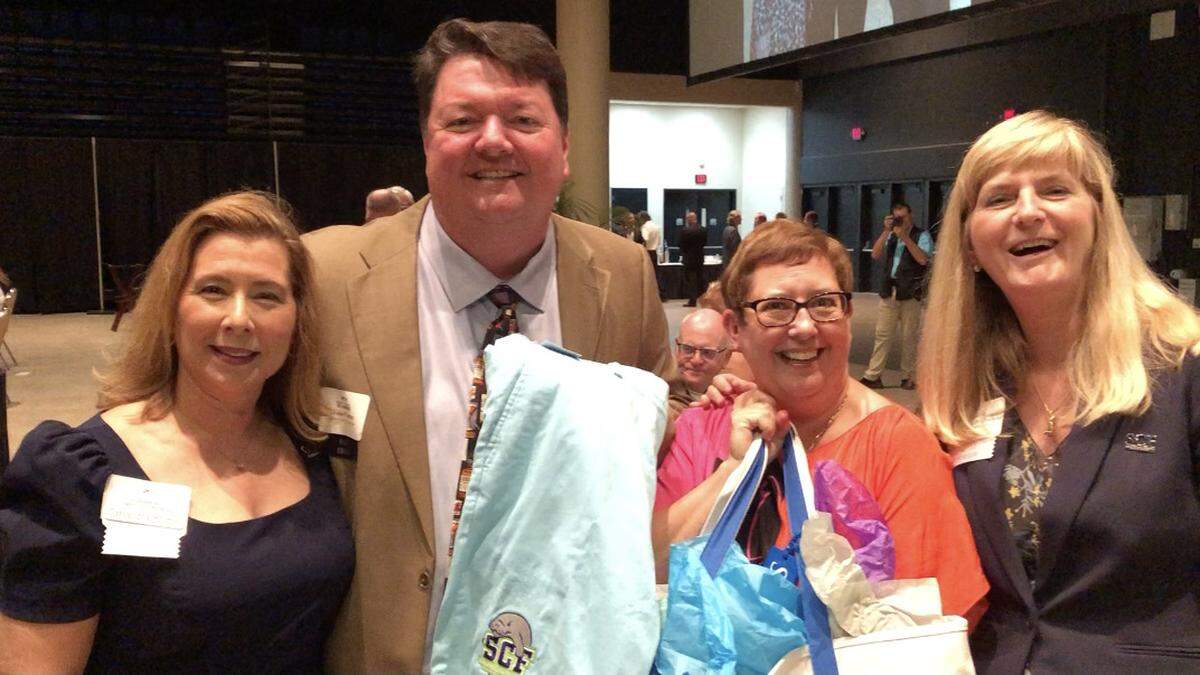 6/24/2021--John and Amanda Horne, recipients of Manatee Chamber of Commerce’s fourth-annual Robert P. Bartz Award for Outstanding Leadership, are shown with Cassandra Holmes, executive director of of the SCF Foundation, and Carol Probstfeld, president of State College of Florida.