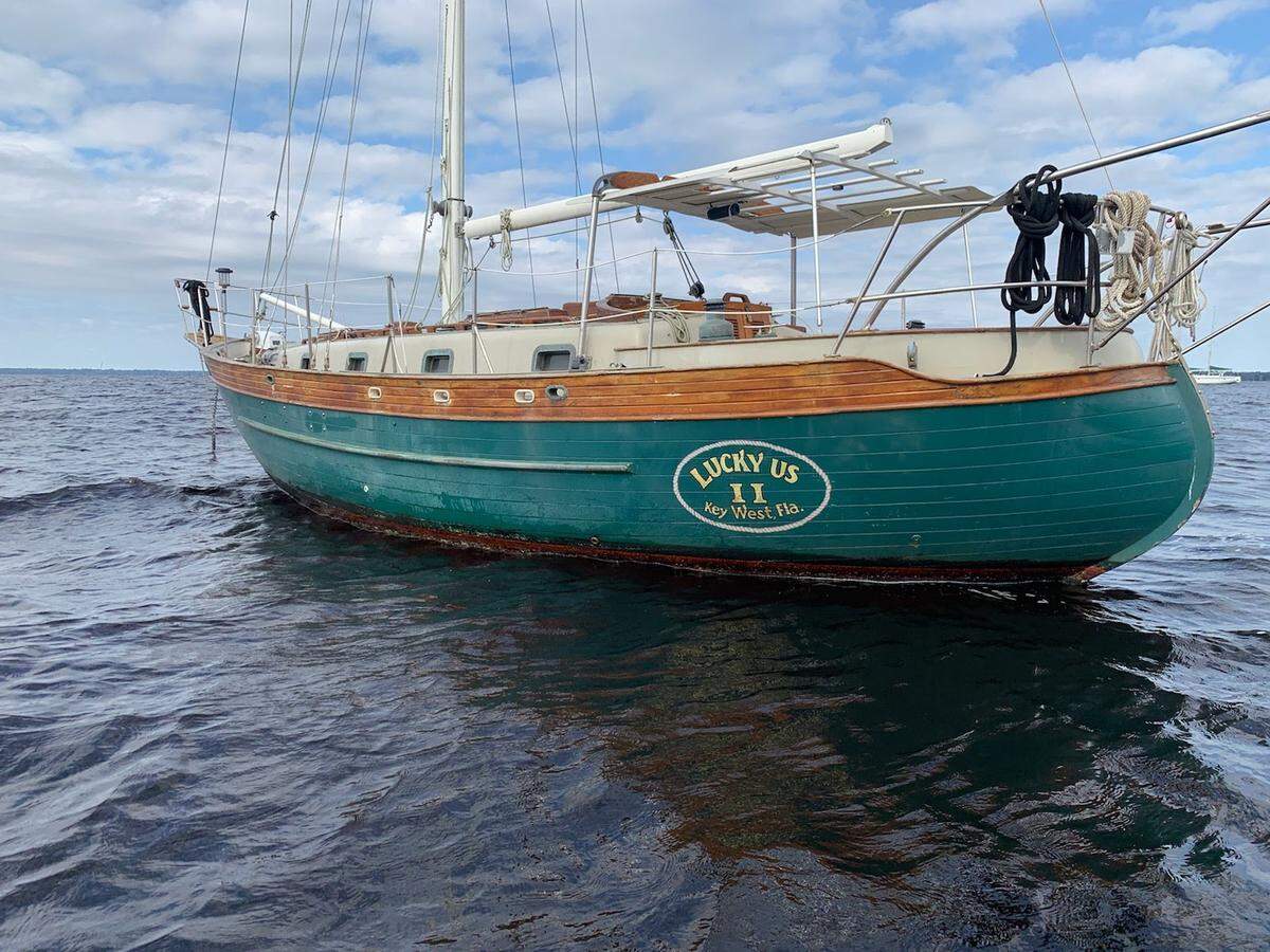 ”Lucky Us 2,” a 35-foot Young Sun yacht, is anchored before a storm pushed it onto Anna Maria Island&nbsp;on Feb. 12, 2023. 