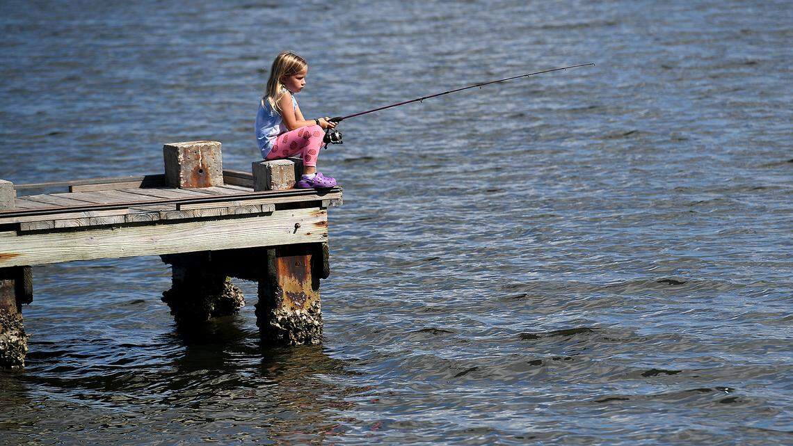 Emily Fenton, 5, fishes off the dock at the Palma Sola Causeway with her family in October of 2021.