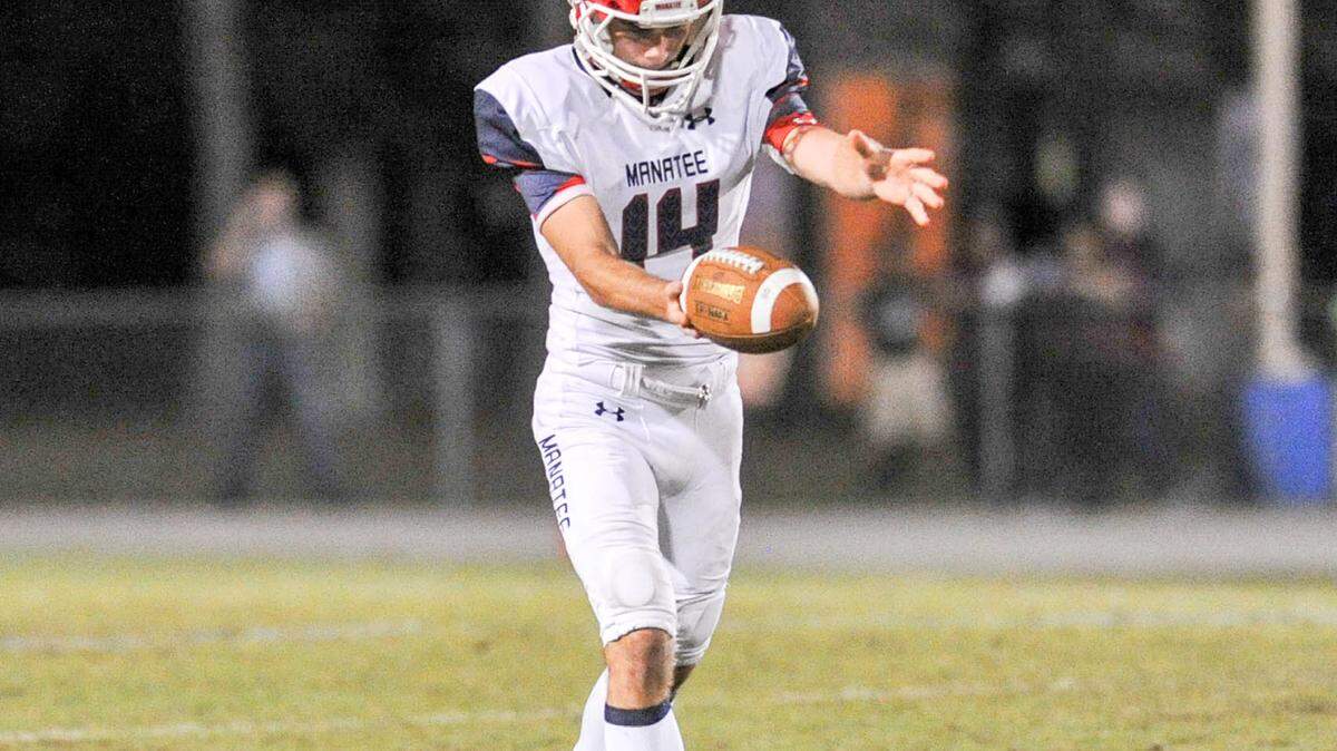 Manatee kicker Nick Null punts the ball