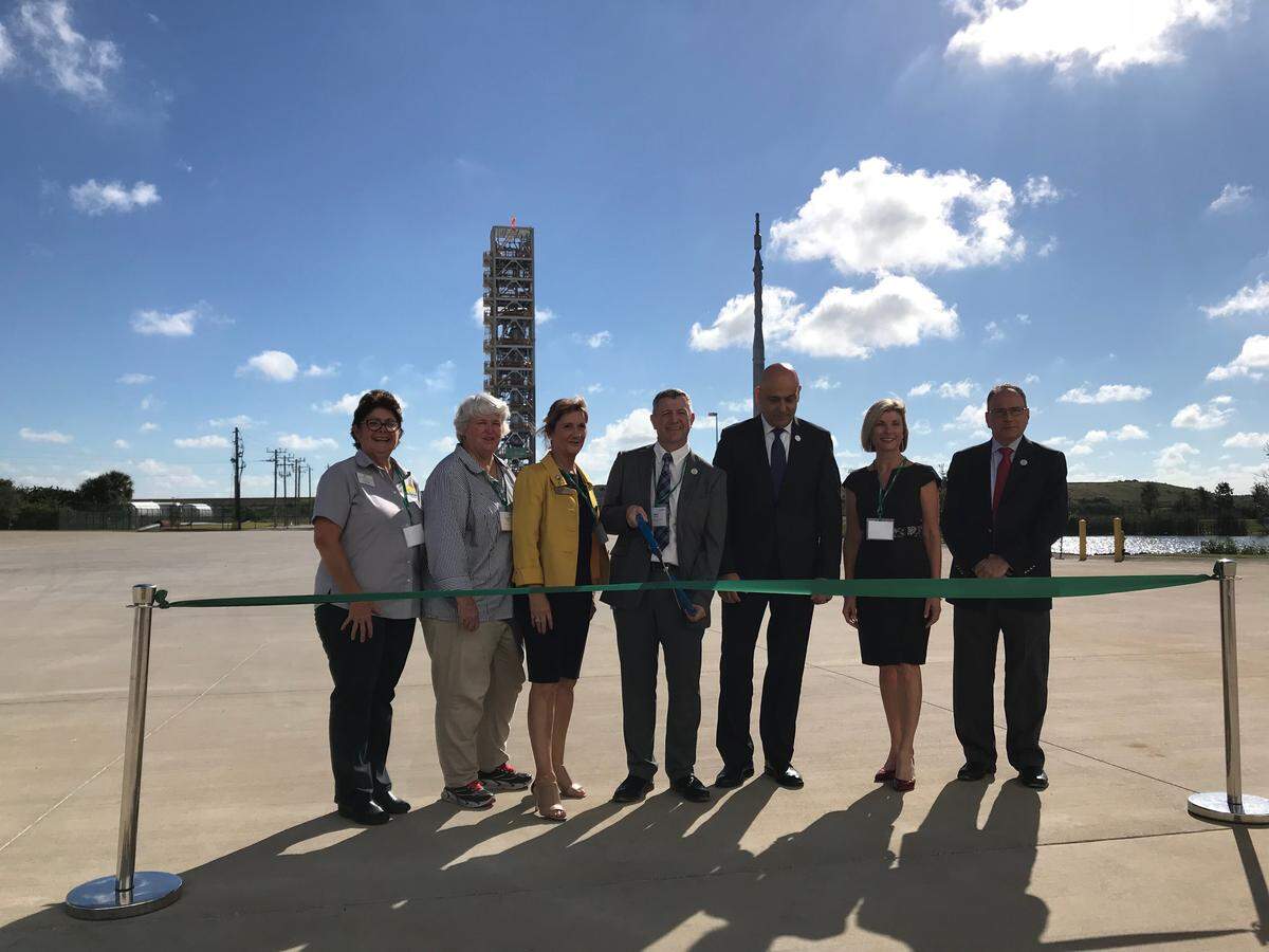 Air Products’ new equipment test facility towers over the ribbon cutting ceremony that marked its activation on Thursday.