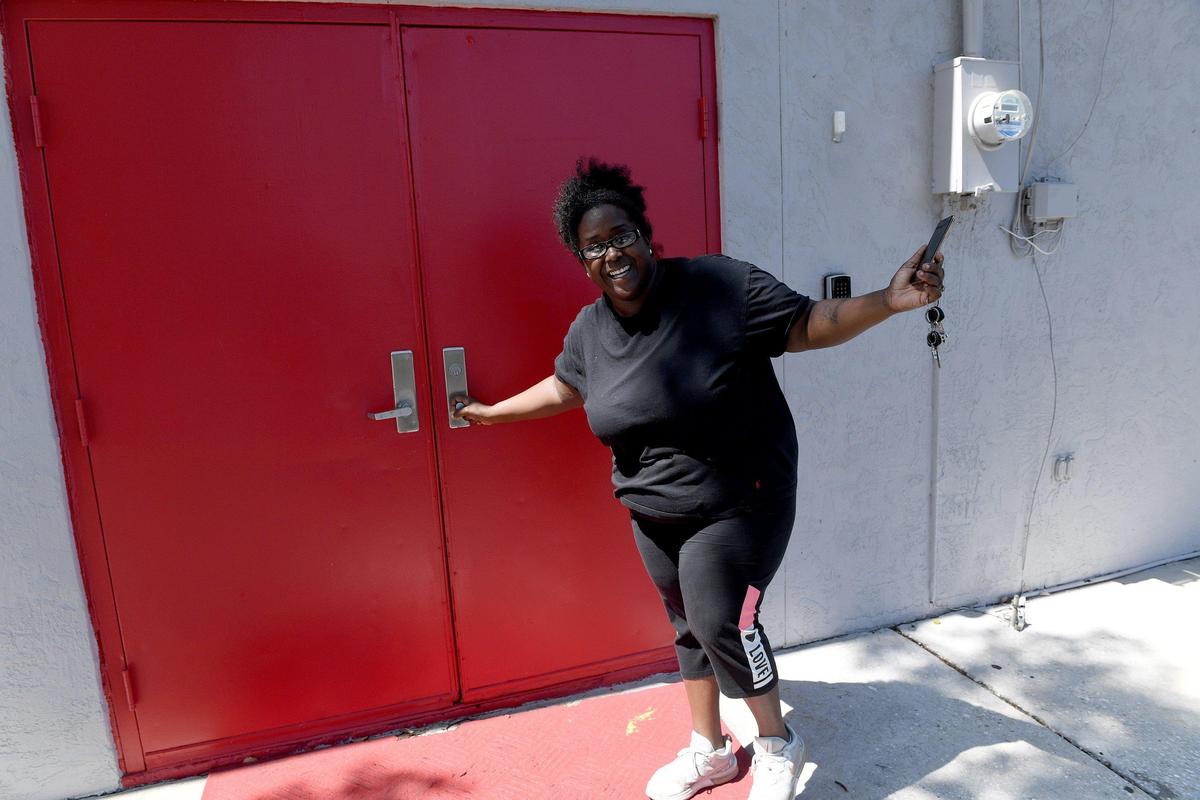 Debra Smith-Coleman tries to open the doors to the former Tallevast Community Center, now called the Center for Success. The doors were locked at 3:30 May 29, though there was a car parked in the lot.