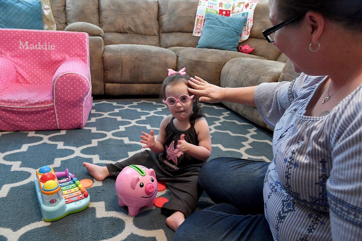 Maddie Gordon, 2, plays with her favorite toys as mom, Kristin, plays too. Maddie’s pediatric therapy program at Blake Medical will soon be moving to Manatee Memorial Hospital.