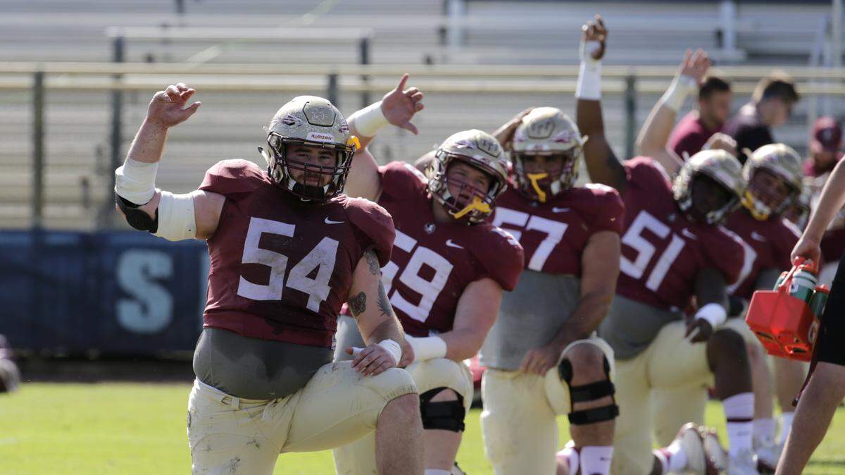 In this Dec. 27, 2016, file photo, Florida State offensive lineman Alec Eberle (54) stretches during NCAA college football practice, in Fort Lauderdale. Most who watched Florida State last season thought QB Deondre Francois was the team’s toughest players for the hits that he took. It ended up being center Alec Eberle, who kept playing despite two labral tears in his hip. A healthy Eberle could be the key to an offensive line that has struggled the past two seasons.