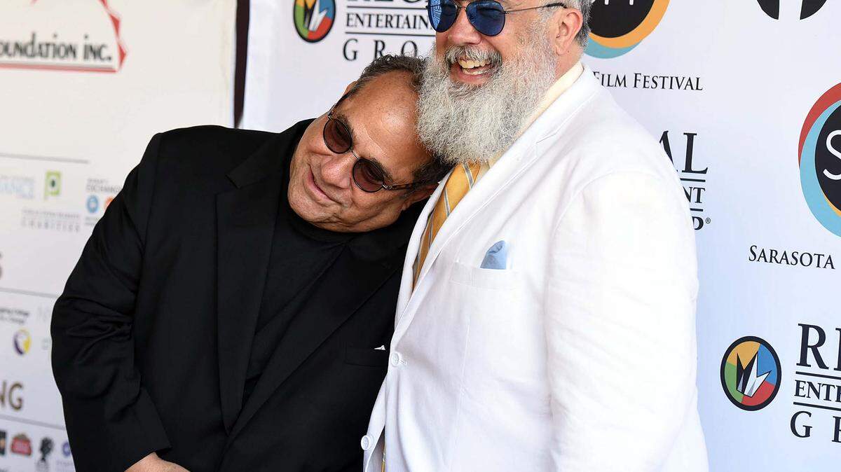 Sarasota Film Festival president Mark Famiglio and director of programming Michael Dunaway pose on the red carpet outside the theater at Van Wezel on opening night. 
 TIFFANY TOMPKINS/Bradenton Herald