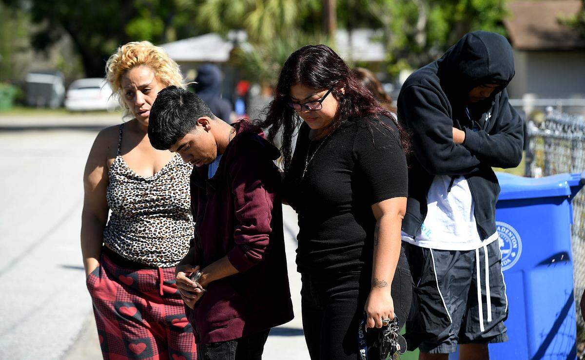 02/12/21--Friends and family of Antonio Aguirre, 20, mourn his loss where he was fatally shot in a drive-by shooting in the 700 block of 25th Street East Thursday night.