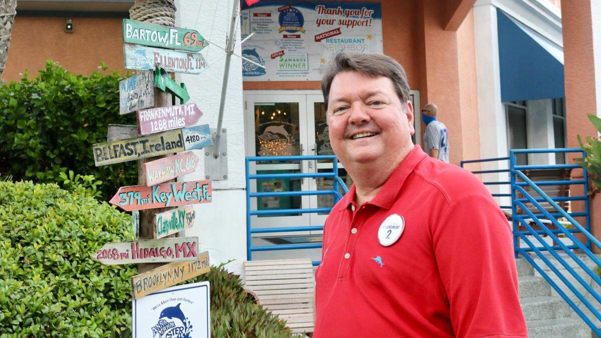 John Horne, owner and CEO of Anna Maria Oyster Bar, is marking 25 years of building the local restaurant brand. The sign post at his Landside restaurant is topped with a marker for Bartow, his original home town.