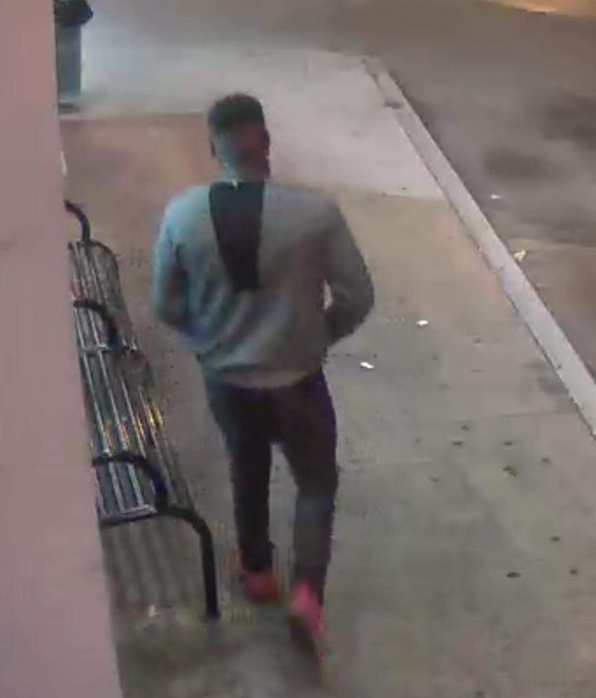 Police said surveillance cameras in the area where a woman said she was sexually battered showed a medium-build man wearing a long-sleeve gray shirt, dark pants and gray tennis shoes.