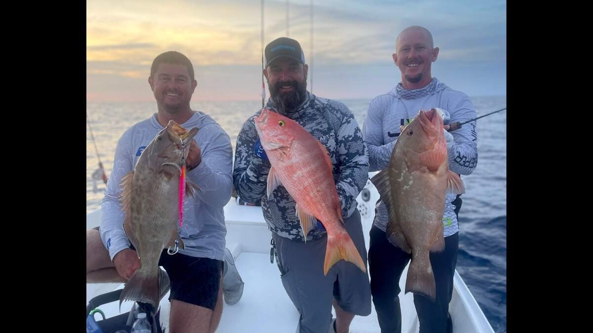 Team Big Game poses with some of the fish they caught using the slow-pitch jigging fishing technique to win the inaugural International Jigging Casting Association Tournament in July 2023. From left: Derek Engle, Benny Ortiz and Chad Busiere.