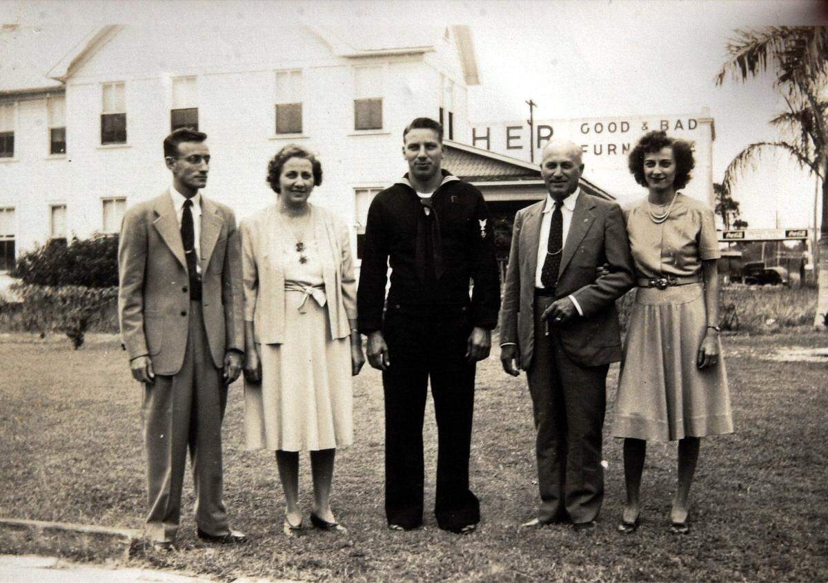 The Griffith family stands outside the Griffith Cline Funeral Home property in 1944, facing west along Manatee Avenue West. From left, they are Donald Griffith, Ruth Griffith, Oscar “Buster” Griffith, Jesse Griffith, Helen Griffith Jordan.