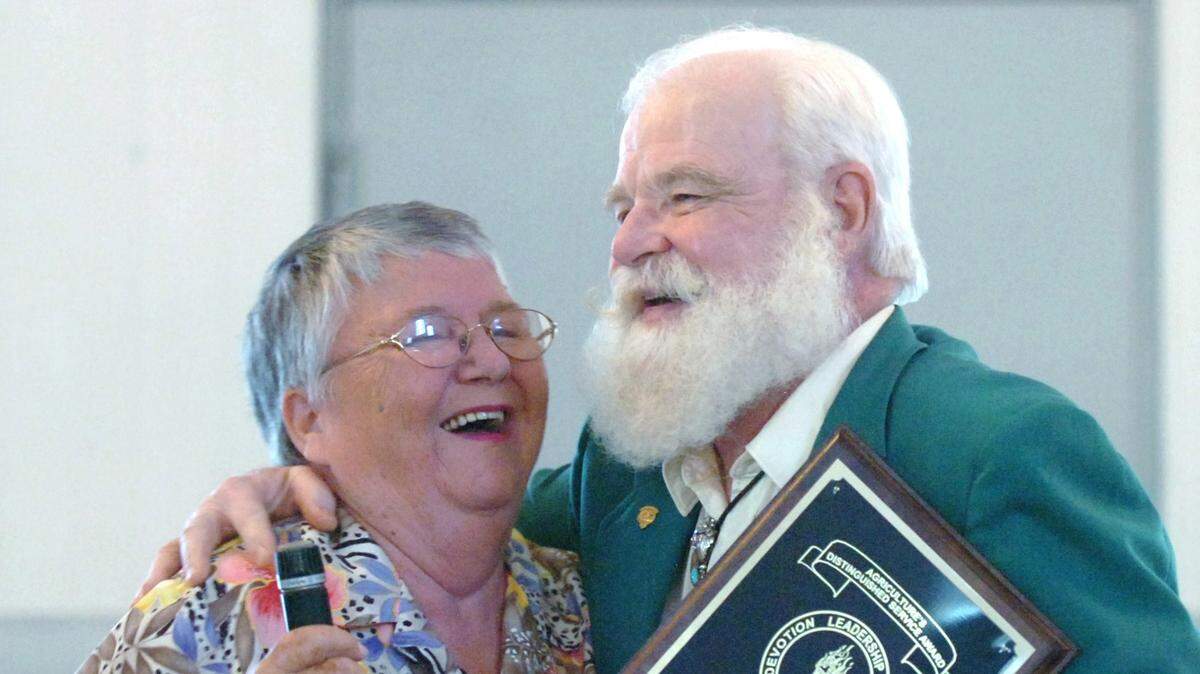 Betty Glassburn is hugged after introducing Manatee County Agriculture Hall of Fame inductee John O’Connor at the Farm City Week 2010 Hall of Fame luncheon.

