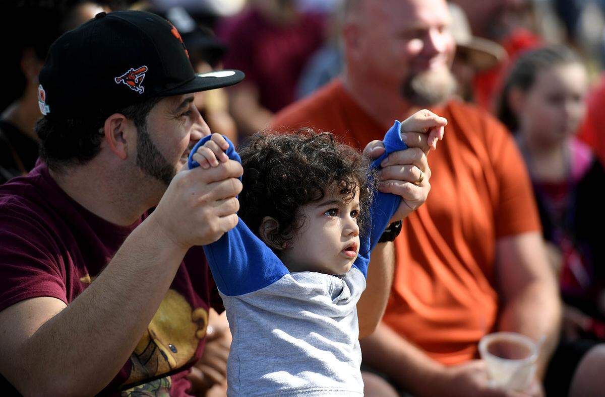 11/14/21—A young boy watches Acrobellum perform at the Sarasota Medieval Fair in Myakka Sunday.