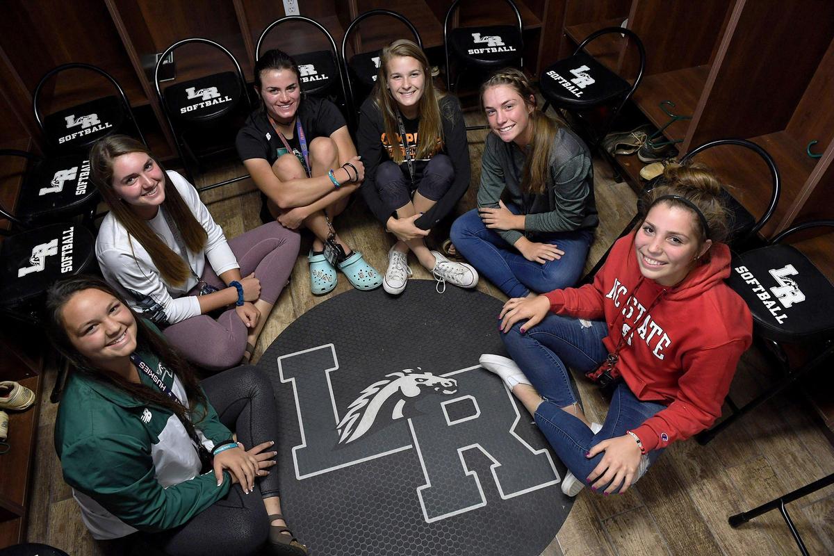 The Lakewood Ranch girls softball team, Payton Kinney, Claire Davidson, Avery Goelz, Kayla Howald, Jill Herbst and Brooklyn Lucero in their locker room before heading out to play a game against Venice.