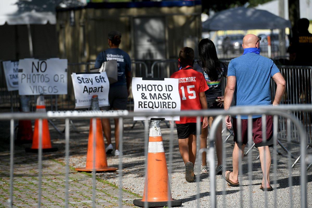 People get free COVID-19 testing sponsored by the State of Florida at Lincoln Park in Palmetto.