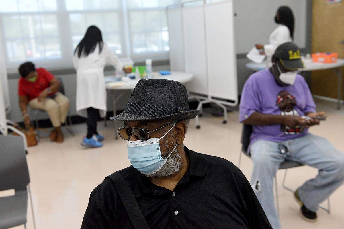02/10/21--Leo Alexander Scott waits for his vaccine during an MCR Health COVID-19 vaccination event for area residents at the Rubonia Community Center.