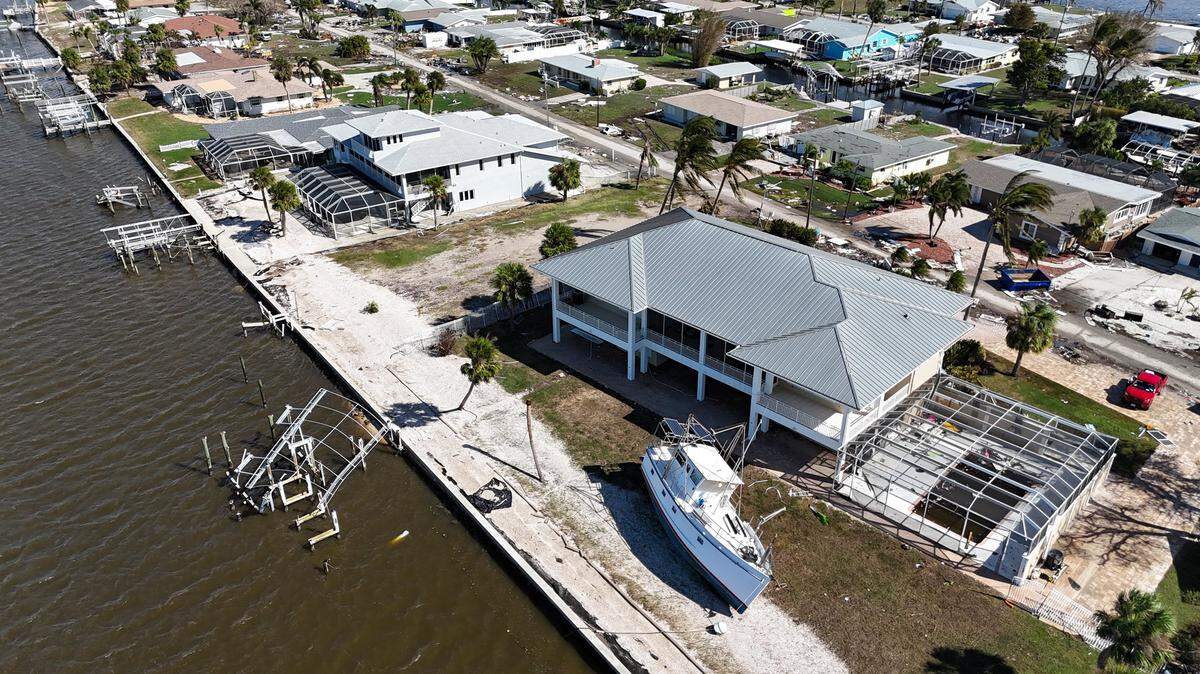 Damage and debris is seen in a neighborhood in Charlotte County near Manasota Key on Thursday, Oct. 10, 2024, the morning after Hurricane Milton hit the area.