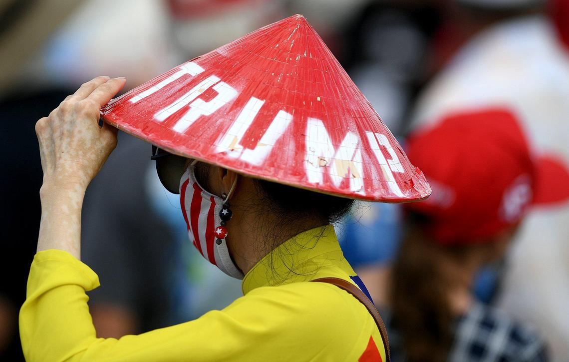 People arrive before President Trump holds a rally in a parking lot at Raymond James Stadium in Tampa October 29.
