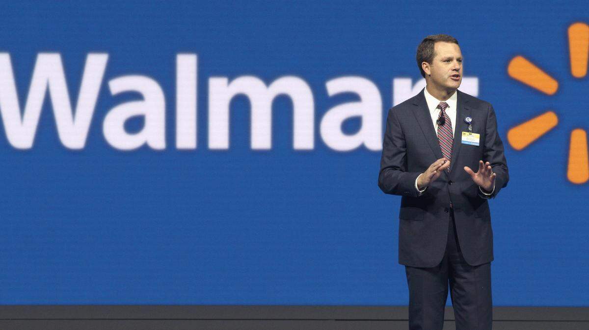 In this Friday, June 5, 2015 photo, Wal-Mart Chief Executive Officer Doug McMillon speaks at the company's shareholder meeting in Fayetteville, Ark. On Friday, Oct. 2, 2015, Wal-Mart laid off 450 workers at its headquarters in Bentonville, Ark., as the world's largest retailer attempts to become more nimble to compete with the likes of Amazon.com. (AP Photo/Danny Johnston)
