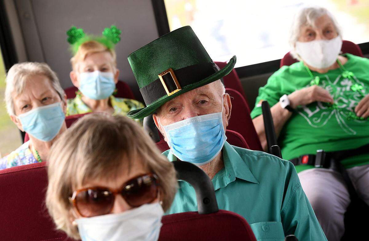 03/17/21--A small busload of seniors from Cypress Springs dressed for the occasion of getting their second dose of the COVID-19 vaccine at the Premier Sports Complex in Lakewood Ranch.