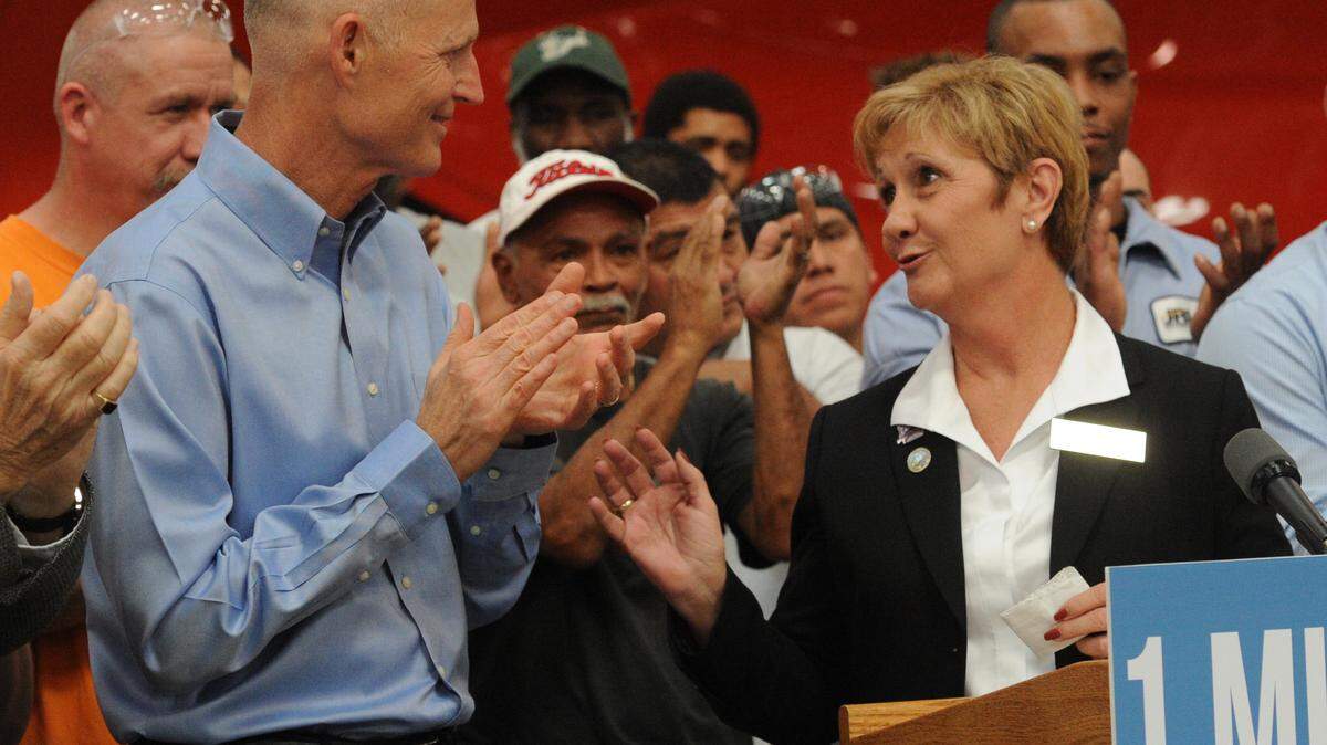 Manatee County Commissioner Vanessa Baugh greets Florida Gov. Rick Scott at Marine Concepts, the second-to-last stop on his victory lap for Florida adding more than a million jobs since 2010. 
 GRANT JEFFERIES/Bradenton Herald
