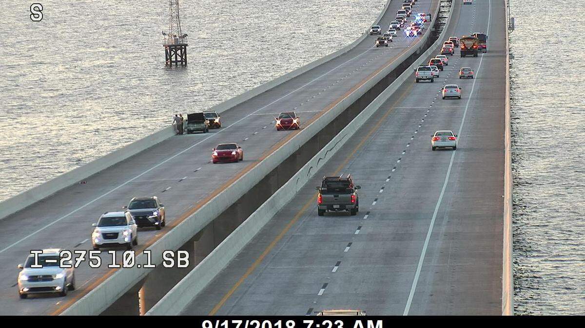 A vehicle fire and a crash slowed traffic and closed at least one lane of northbound Interstate 275 on the Sunshine Skyway Bridge Monday morning, according to Florida Highway Patrol.